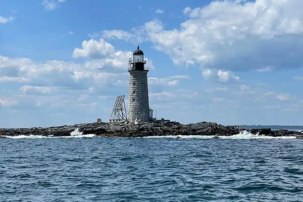 Lighthouse surrounded by water in coastal Maine